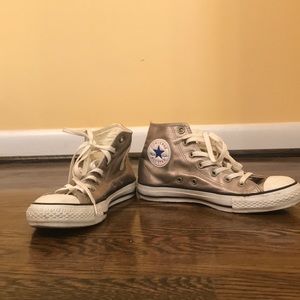 Gently worn gold converse high top sneakers